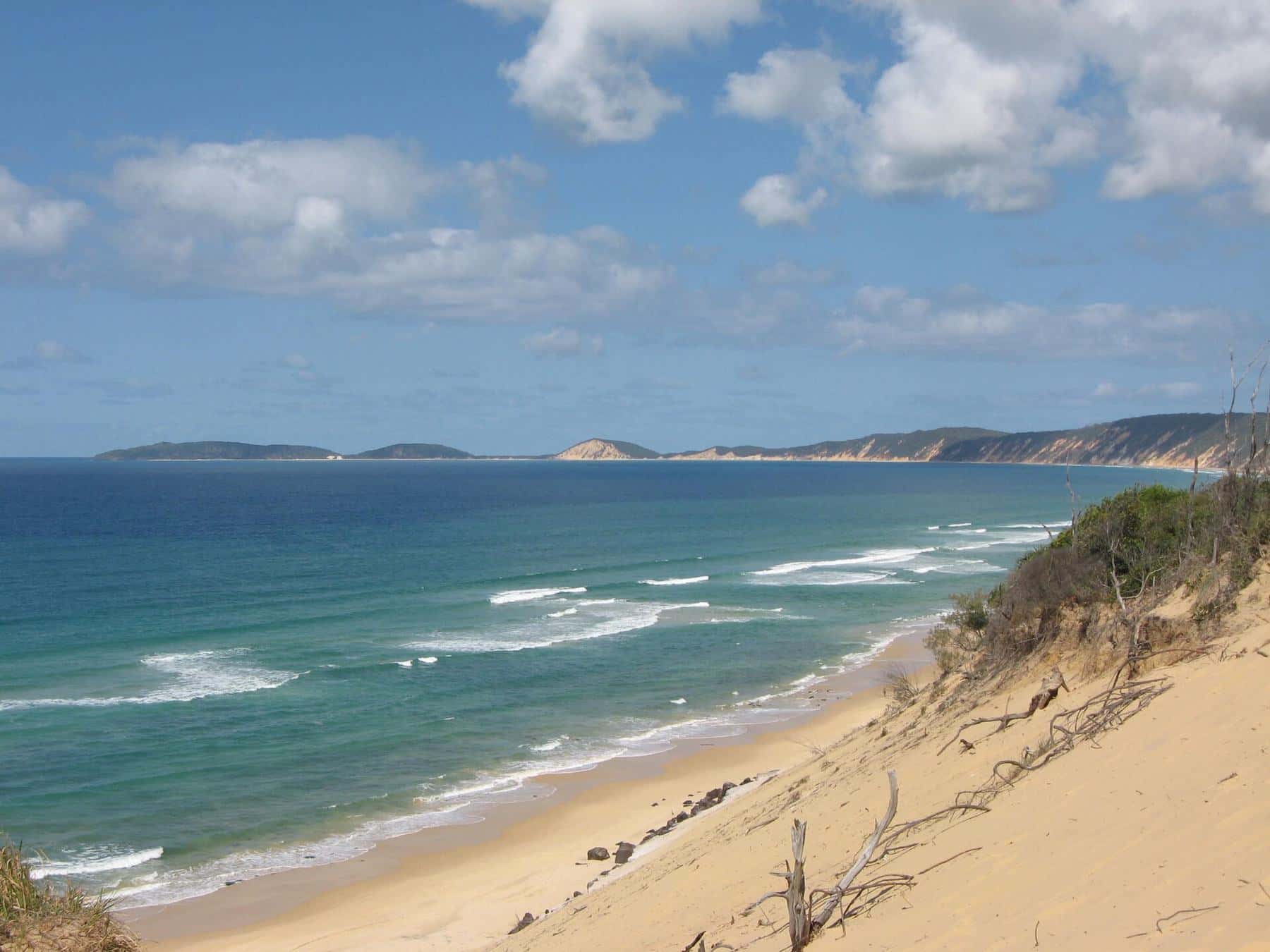 Carlo Sandblow and the coloured sand cliffs looking south to Double Island Point